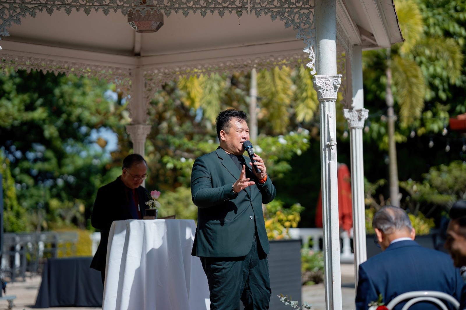 Emcee Dixon hosting outdoors at a Singapore event