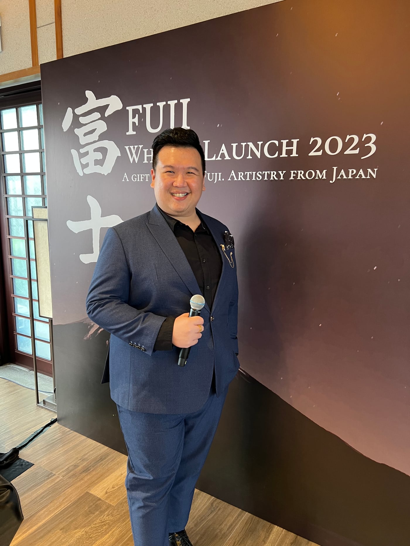 Emcee Dixon hosting a product launch in Singapore