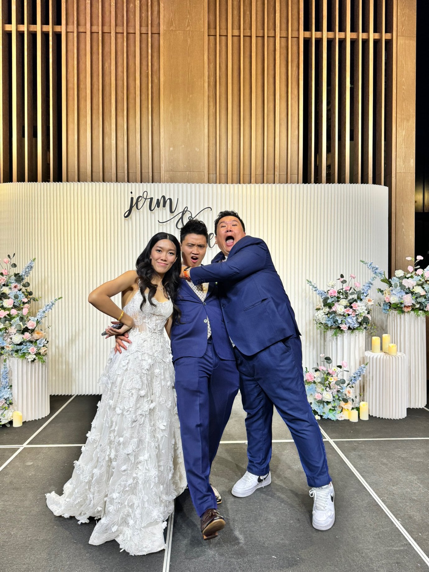 Emcee Dixon having fun with a bride and groom at their wedding in Singapore