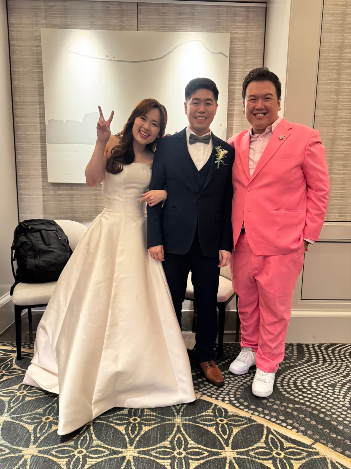 Emcee Dixon with a couple at their Singapore wedding